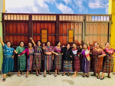 women giving thumbs up